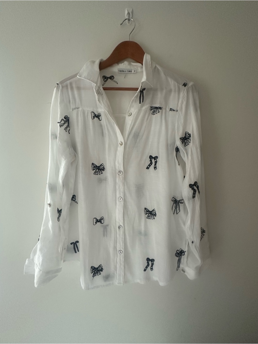 White women’s Button-Down Top with black Bow Motif